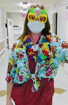 Christian Heights Nursing and Rehab staff member dressed in Hawaiian attire