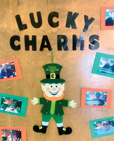 door decorated with leprechaun and photos for St. Patrick's day