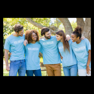 group of young adults in baby blue shirts that say volunteer