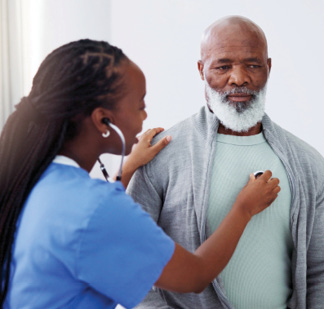 Female nurse listening to adult man's heart through stethoscope.